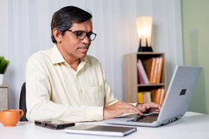 Man looking at his computer